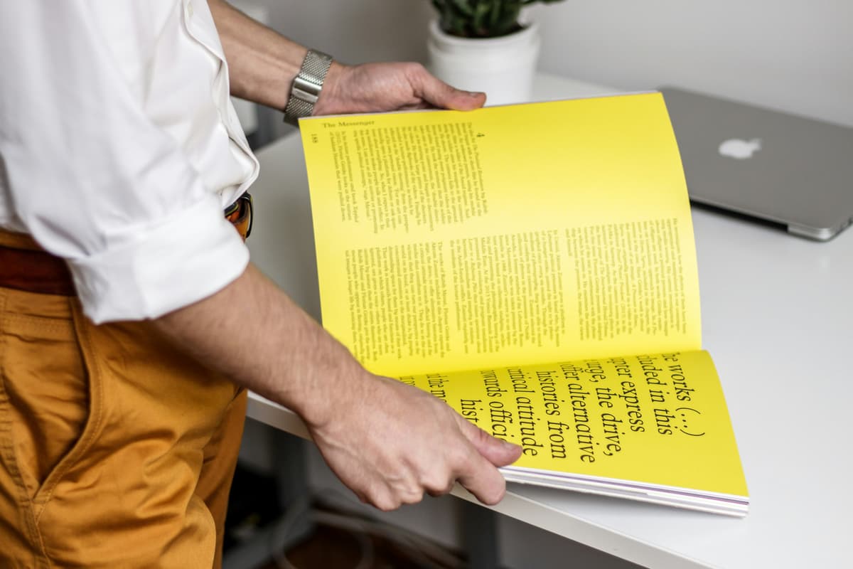 Reader engaged with a book, reflecting PRC Publishing's professional readership